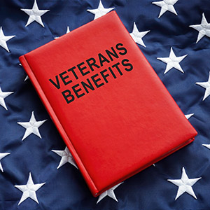 Book veterans benefits on a big flag.