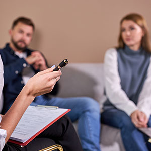 A couple consults with a mediator, representing divorce mediation in Maryland.